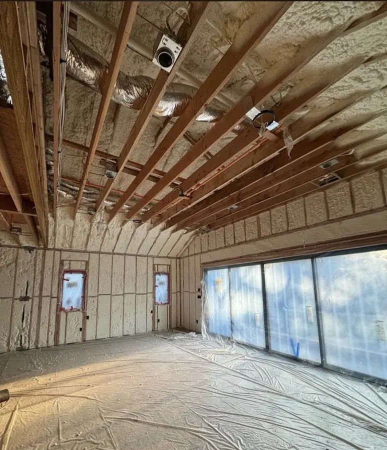 Interior walls and ceiling insulated with spray foam during new construction in Burbank